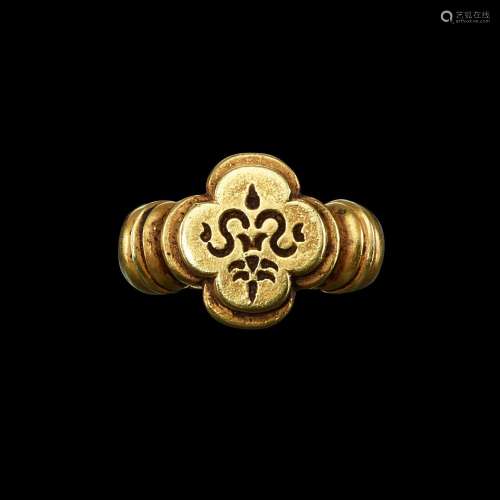 . A gold ring with quatrefoil bezel of a 'Sri' symbol Java, ...