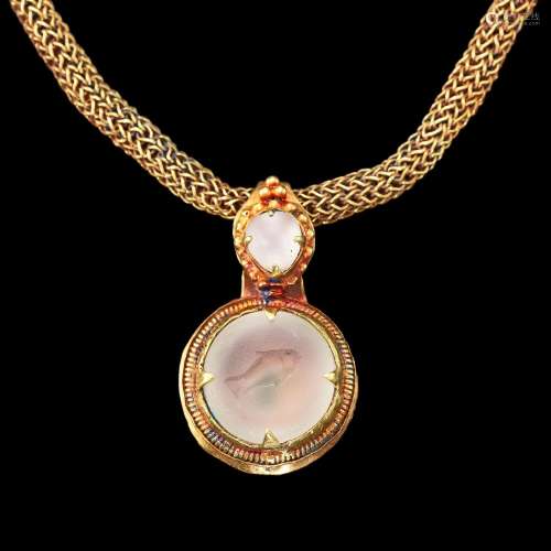 . A solid gold necklace with a crystal intaglio of a fish Kh...