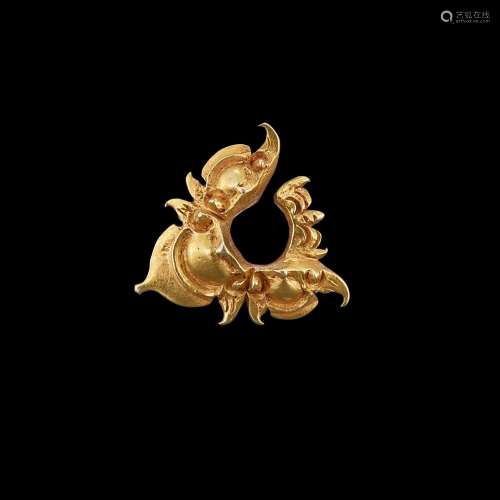 . A pronged solid gold earring Java, Indonesia, 7th - 12th c...