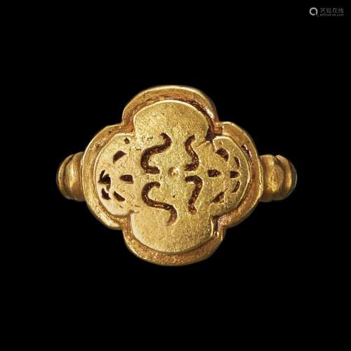 . A solid gold ring with quatrefoil bezel of a flowerpot and...