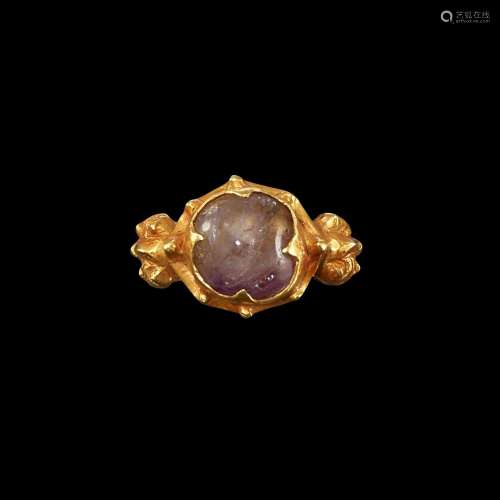 . A gold and crystal ring with protube-ring shoulders Java, ...