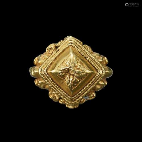 . A gold ring with diamond bezel repoussé crowned with flowe...