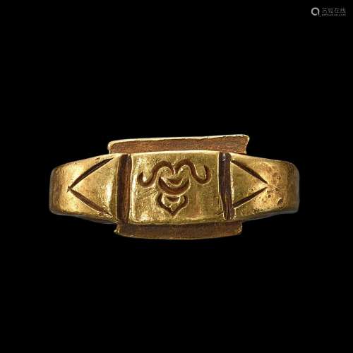 . A solid gold ring with an incised bezel of a 'Sri' symbol ...