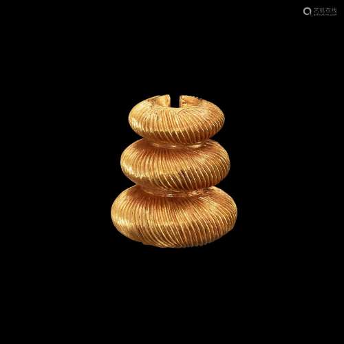 . A gold cord fastener with chiseled groves Java, Indonesia,...
