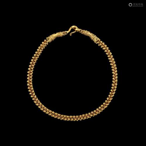 . A solid gold necklace with cruciform terminals Khmer, 9th-...