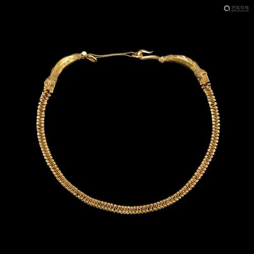 . A solid gold necklace with naga head terminals East Java, ...