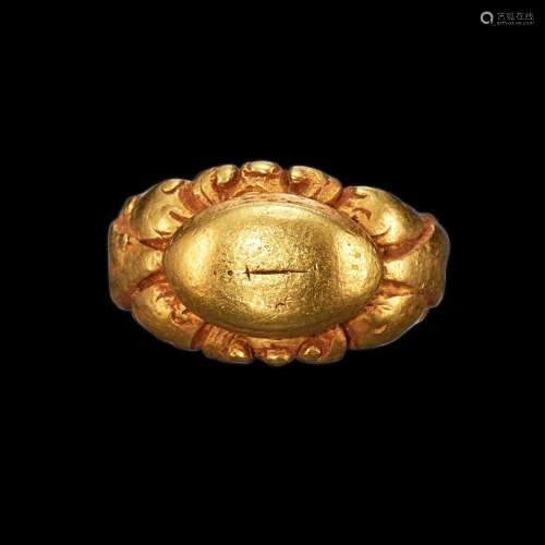 . A solid gold ring with floral shank and engraved 'Ankusa' ...