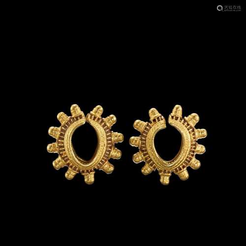 . A pair of granulated solid gold earrings Java, Indonesia, ...