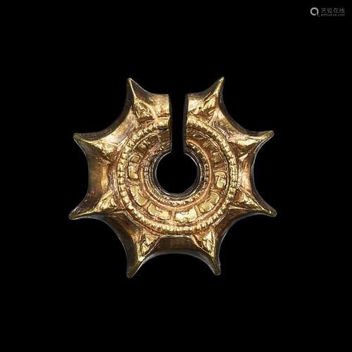 . A star-shaped solid gold earring Java, Indonesia, 7th - 12...