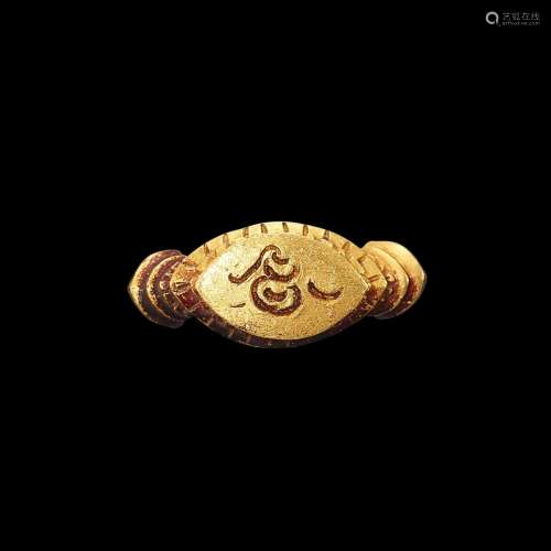 . A solid gold ring with patina and incised 'Sri' symbol Jav...