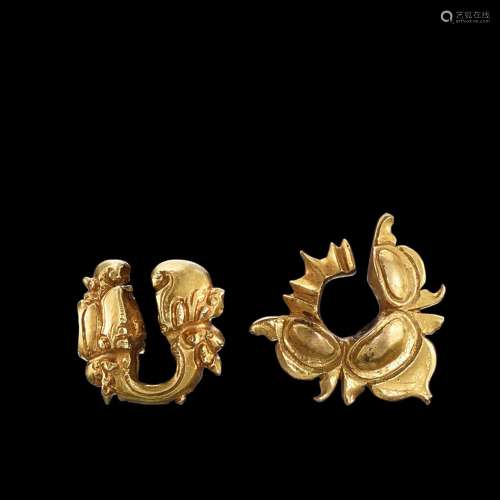 . Two solid gold ear ornaments Java, Indonesia, 7th - 12th c...