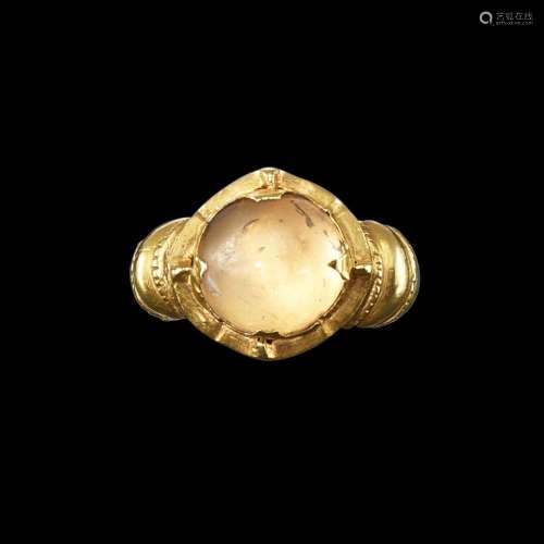 . A gold and crystal ring with ribbed shank Java, Indonesia,...