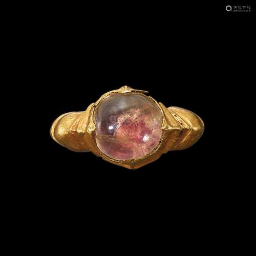 . A gold and crystal ring with ribbed shank Java, Indonesia,...