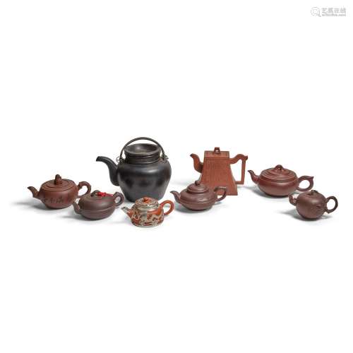 A GROUP OF EIGHT YIXING TEAPOTS AND COVERS 20th century