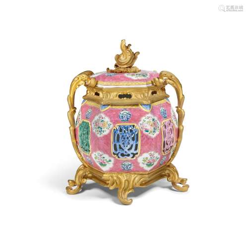 A FAMILLE-ROSE RETICULATED HEXAGONAL JAR AND COVER WITH LATE...