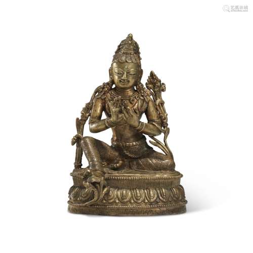 A SILVER AND COPPER-INLAID BRONZE FIGURE OF MAITREYA