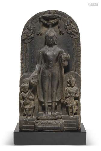 A RARE BLACK STONE STELE OF THE BUDDHA'S DESCENT FROM TH...