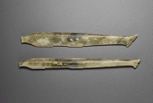 TWO MOTTLED DARK GREY AND GREYISH-OLIVE JADE 'FISH’ PEND...
