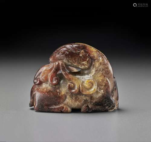 A MOTTLED RUSSET AND GREY JADE FIGURE OF A RAM