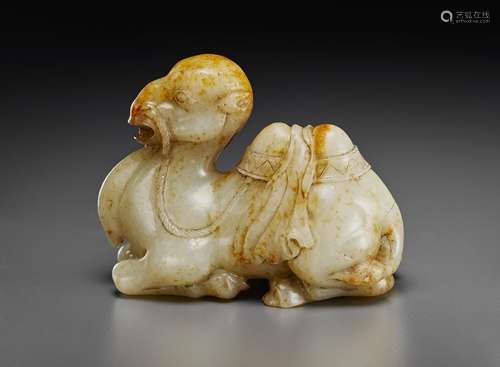 A FINELY CARVED PALE GREY AND RUSSET JADE FIGURE OF A RECUMB...