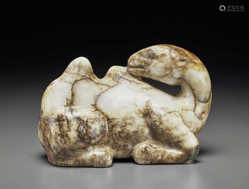 A MOTTLED GREY, BLACK AND RUSSET JADE FIGURE OF A RECUMBENT ...