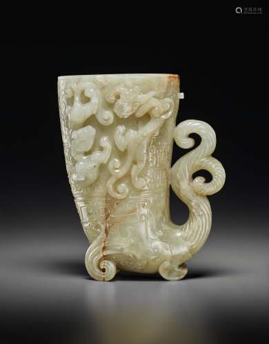 A FINELY CARVED PALE GREYISH-WHITE JADE RHYTON, GONG
