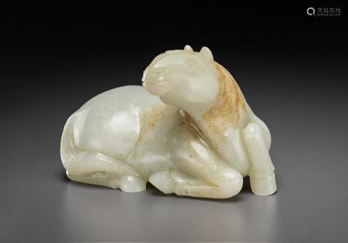 A WHITE AND RUSSET JADE FIGURE OF A RECUMBENT HORSE