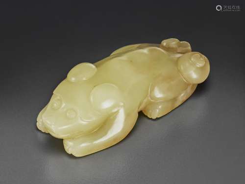 A PALE YELLOW JADE FIGURE OF A RECUMBENT DOG
