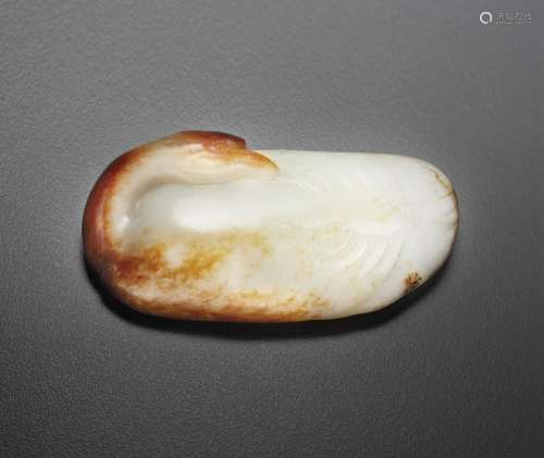 A WHITE AND RUSSET JADE FIGURE OF A RECUMBENT GOOSE
