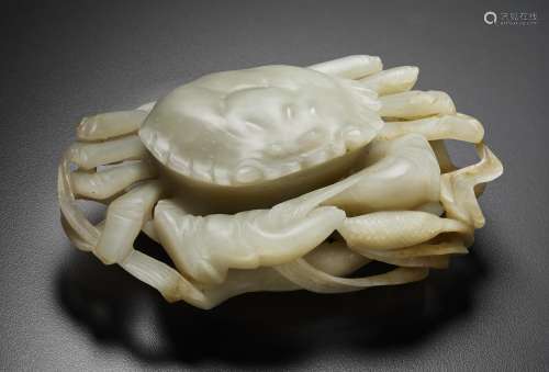 A PALE GREYISH-WHITE AND RUSSET JADE FIGURE OF A CRAB