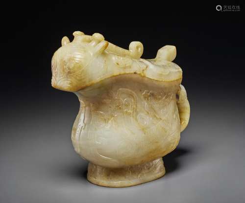 A RARE PALE BEIGE AND RUSSET JADE ARCHAISTIC GONG -FORM VESS...