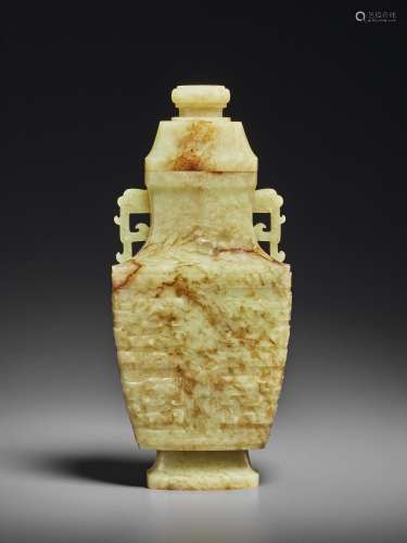 A PALE YELLOW AND RUSSET JADE ARCHAISTIC VASE AND COVER
