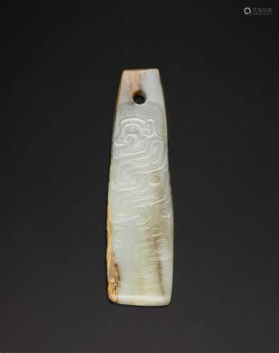 A VERY RARE AND FINELY CARVED WHITE JADE TABLET PENDANT