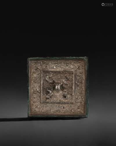 A SMALL SQUARE SILVER-BACKED BRONZE 'LION AND GRAPEVINE’...