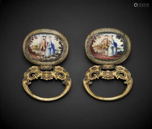 A RARE PAIR OF EUROPEAN ENAMEL-INSET GILT-BRONZE BELT SLIDES