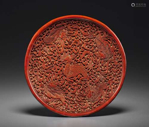 A RARE CARVED RED LACQUER ' QILIN’ DISH