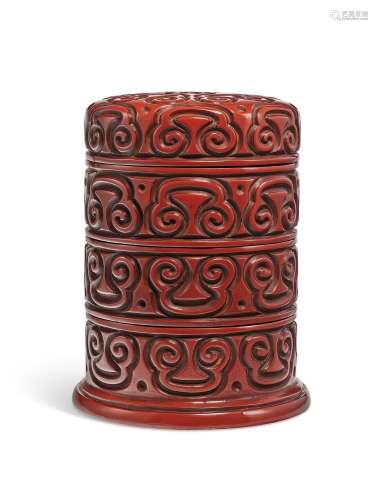 A CARVED THREE-TIERED RED TIXI LACQUER CIRCULAR BOX AND COVE...