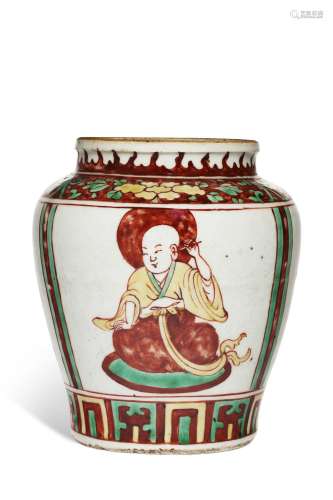 AN IRON-RED, YELLOW AND GREEN-ENAMELED ' LUOHAN ' JA...