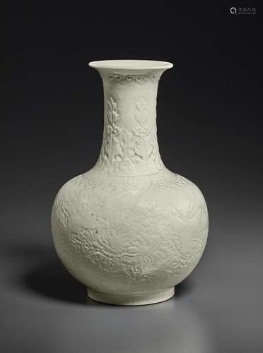 A MOLDED WHITE-GLAZED SOFT-PASTE BOTTLE VASE