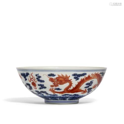 AN IRON-RED AND BLUE AND WHITE 'DRAGON’ BOWL