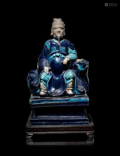 A Fahua Porcelain Figure of Seated Guardian, Guanyu