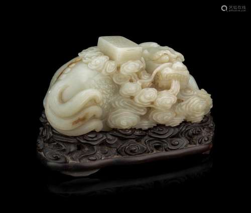 A Pale Celadon Jade 'Qilin and Book' Carving