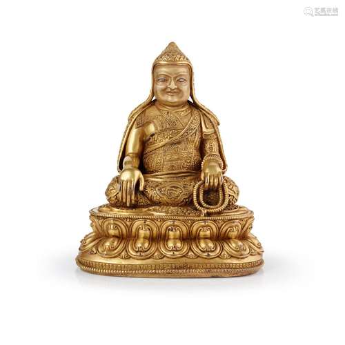 GILT BRONZE FIGURE OF A GELUGPA LAMA QING DYNASTY, 19TH CENT...