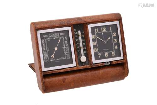 A SWISS LEATHER-CASED TRAVELLING ALARM TIMEPIECE COMPENDIUM ...