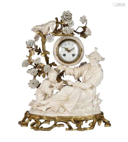 A LOUIS XV STYLE ORMOLU AND 'BLANC DE CHINE' PORCELAIN MANTE...