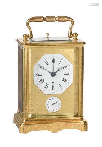 A SWISS ENGRAVED GILT BRASS CENTRE-SECONDS REPEATING ALARM C...