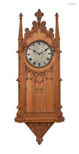 A VICTORIAN GOTHIC REVIVAL CARVED OAK WALL CLOCK