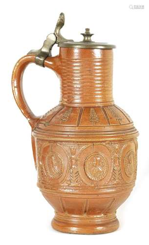 A LATE 16TH CENTURY GERMAN BROWN SALT GLAZED STONEWARE JUG D...