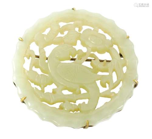 A CHINESE CARVED JADE BROOCH