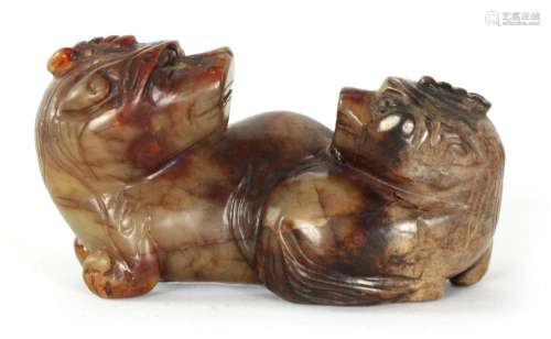 A CHINESE CARVED RUSSET JADE SCULPTURE